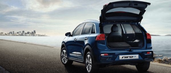 Blue Kia Niro EV with the trunk open