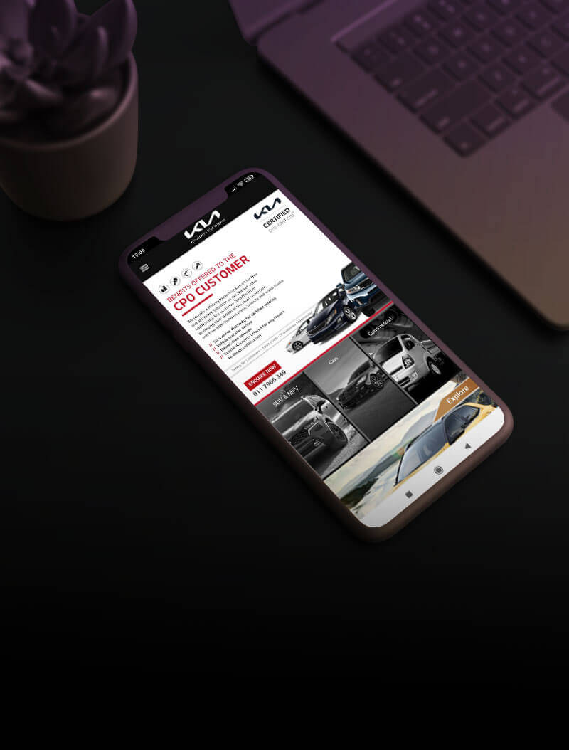 Kia App opened on a mobile phone a computer table
