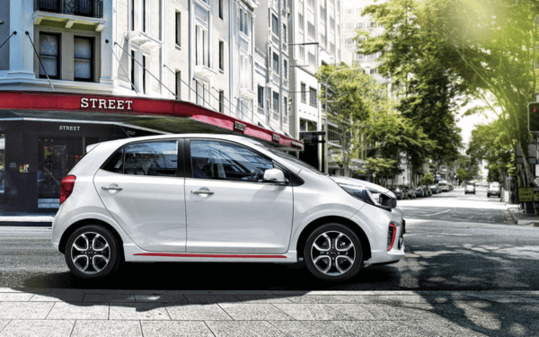 A white color Kia Picanto car in the street