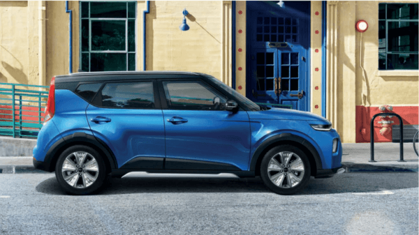 A blue color Kia Soul EV parked in the street